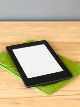 Ebook reader on a wooden table Stock Photos