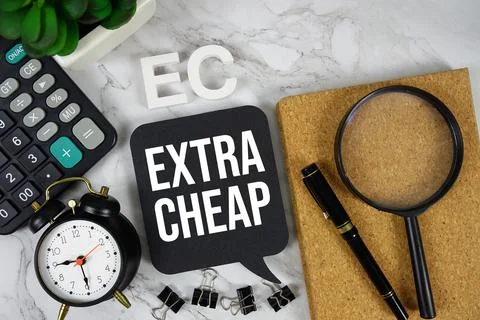 EC - Extra Cheap acronym with calculator, alarm clock and magnifying glass,.. Stock Photos