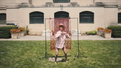 Eccentric stylish dancer performing outdoors in a garden Stock Footage 331597286