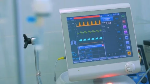 ECG monitor, medical equipment at a ICU in a modern hospital Stock Footage