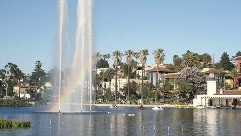 Echo Park Lake with rainbow prism in fountain and people on pedal boat Video stock 75882321