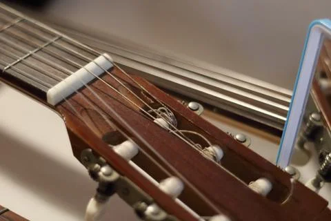 Echoes of Harmony: A Fragmented Reflection of Strings Stock Photos