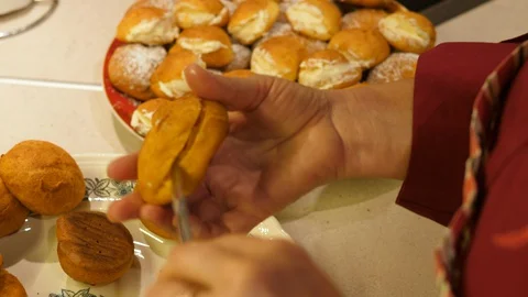 Eclair Baking. Choux Pastry creme made from Butter, Flour, Eggs and Water. Close Stock Footage 129261747