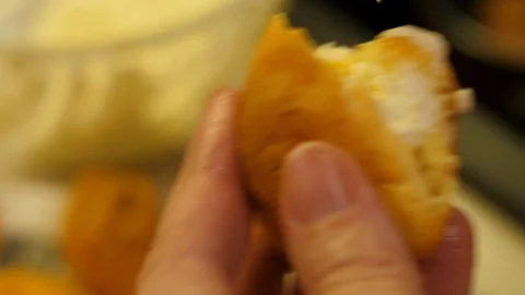 Eclair Baking. Choux Pastry creme made from Butter, Flour, Eggs water. Close-up. 動画素材 129306952