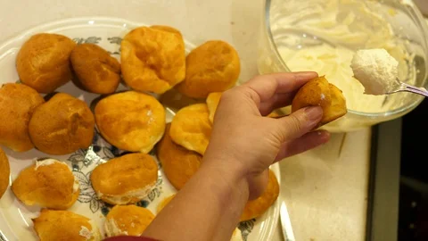 Eclair Baking. Choux Pastry creme made from Butter, Flour, Eggs Water. Closeup. Stock Footage 129307011