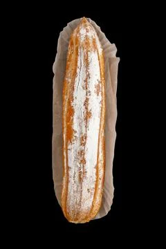 Eclair. isolate on black background. eclair. top view. Stock Photos