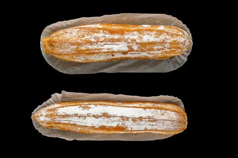 Eclair. isolate on black background. eclair. top view. Stock Photos
