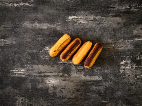 Eclair Puffs dessert on the table Stock Photos