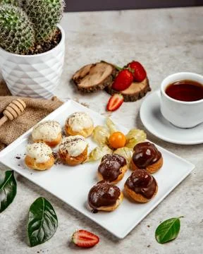 Eclair sets with various filling Stock Photos