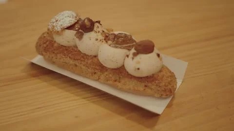 Eclair with tiramisu cream Stock Footage 273437953
