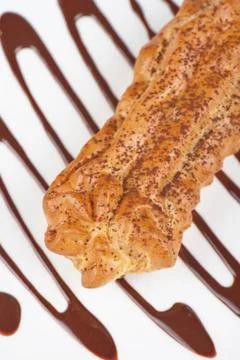 Eclair traditional eclair on a choco background. Copyright: xZoonar.com/Ru... Stock Photos
