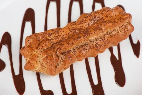 Eclair traditional eclair on a choco background. Copyright: xZoonar.com/Ru... Stock Photos