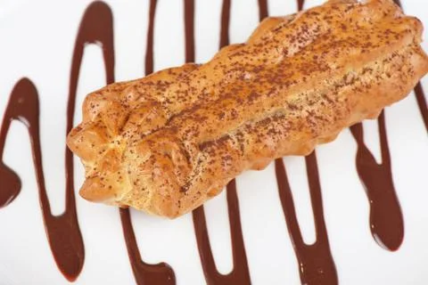 Eclair traditional eclair on a choco background. Copyright: xZoonar.com/Ru... Stock Photos