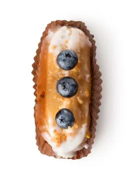 Eclair in white glaze Stock Photos