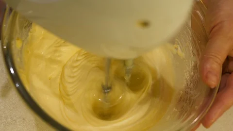 Eclairs baking. Mixing Choux Pastry creme made from Butter, Flour, Eggs Water. Stock Footage 129260239