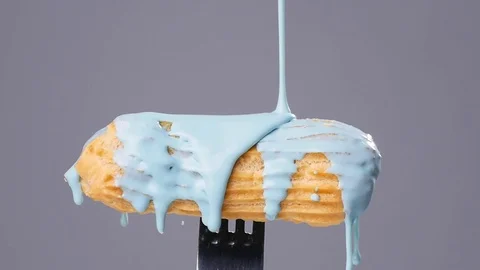 Eclairs with color glaze Stock Footage 69834838