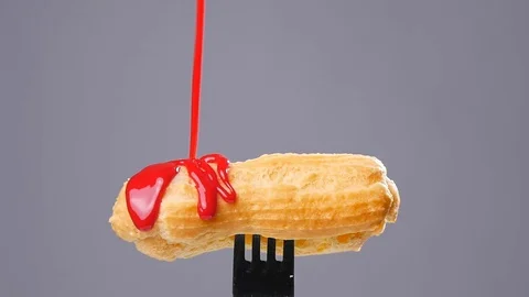 Eclairs with color glaze Stock Footage 69835906