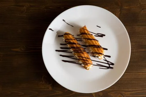 Eclairs with a delicate cream inside Stock-Fotos