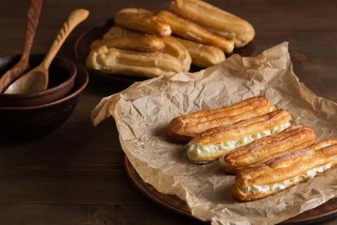 Eclairs with a delicate cream inside Stock Photos