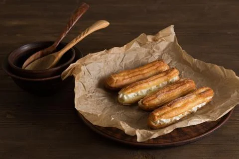 Eclairs with a delicate cream inside Stock Photos