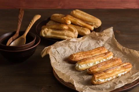 Eclairs with a delicate cream inside Stock Photos