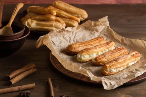 Eclairs with a delicate cream inside Stock Photos