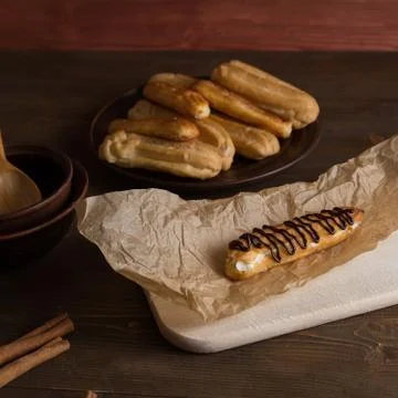 Eclairs with a delicate cream inside Stock Photos
