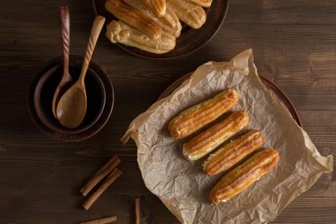 Eclairs with a delicate cream inside Stock Photos