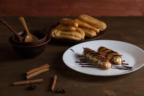 Eclairs with a delicate cream inside Stock Photos