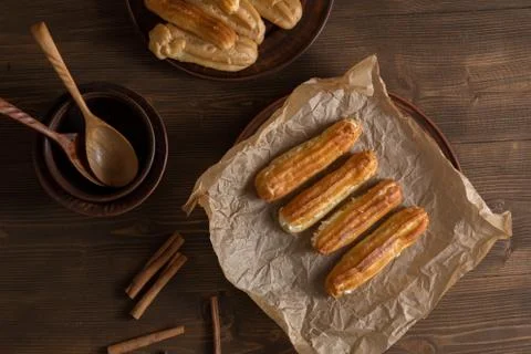Eclairs with a delicate cream inside Stock Photos