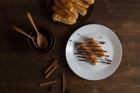 Eclairs with a delicate cream inside Stock Photos