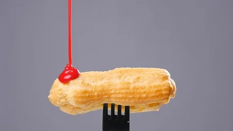 Eclairs with glaze Stock Footage 69835702