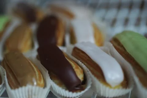 Eclairs on plate Stock Photos