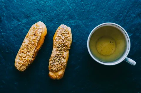 Eclairs On Table Foto stock