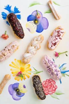 Eclairs with toppings Stock Photos