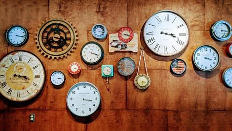 Eclectic Clock Wall Decor in Rustic Interior Stock Photos