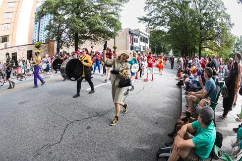 Eclectic marching band performs while walking in Dragon Con parade Stock Photos