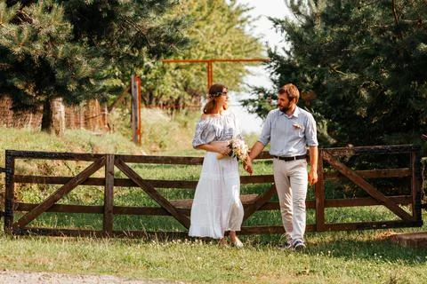 Eclectic rustic wedding couple. Intimate ceremony at backyard Stock Photos