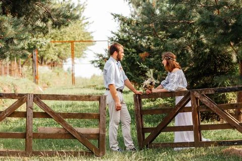Eclectic rustic wedding couple. Intimate ceremony at backyard Stock Photos