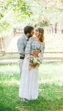 Eclectic rustic wedding couple Stock Photos