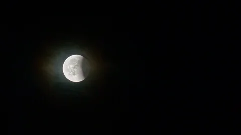 Eclipse Almost Ended. Blood Moon Rising during Lunar Eclipse Surrounded by Mist Stock Footage 93246229