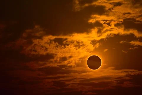 Eclipse on the gold sunset sky and transparent cloud Stock Illustration