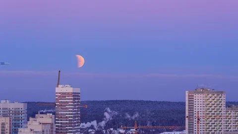 Eclipse of the moon and the sunset of the moon. Yekaterinburg, view of new 動画素材 101505068