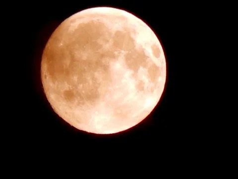Eclipse of the moon in the night sky with a hoop of light around a close-up Stock Photos