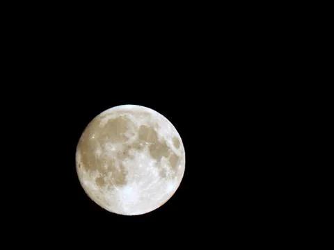 Eclipse of the moon in the night sky with a hoop of light around a close-up Stock Photos