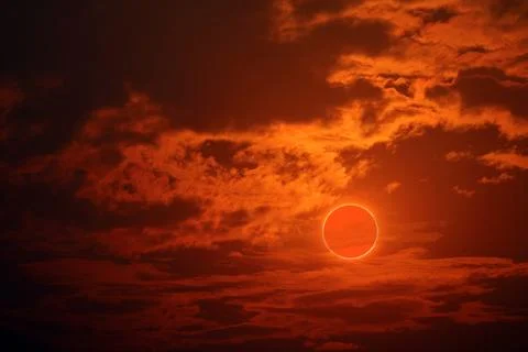 Eclipse on the orange of sunset sky and soft cloud Stock Illustration