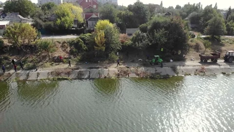 Eco activists clean the reservoir from garbage Stock Footage 157491653