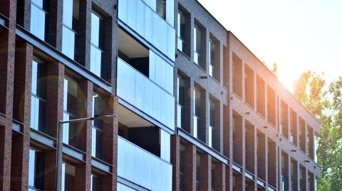 Eco architecture. Green tree and apartment building. Stock Photos