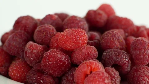 Eco bright colorful berry raspberry rotates 360 on a white background. Close-up Video stock 147181011