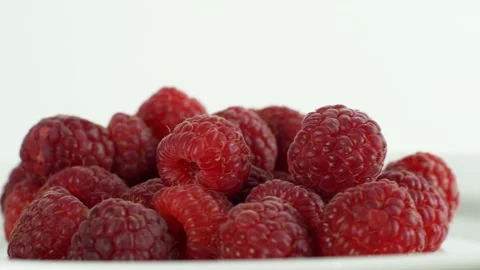 Eco bright colorful berry raspberry rotates 360 on a white background. Close-up Video stock 147185460